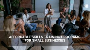 Affordable Skills Training Programs for Small Businesses - woman presenting at employee meeting- Above Promotions