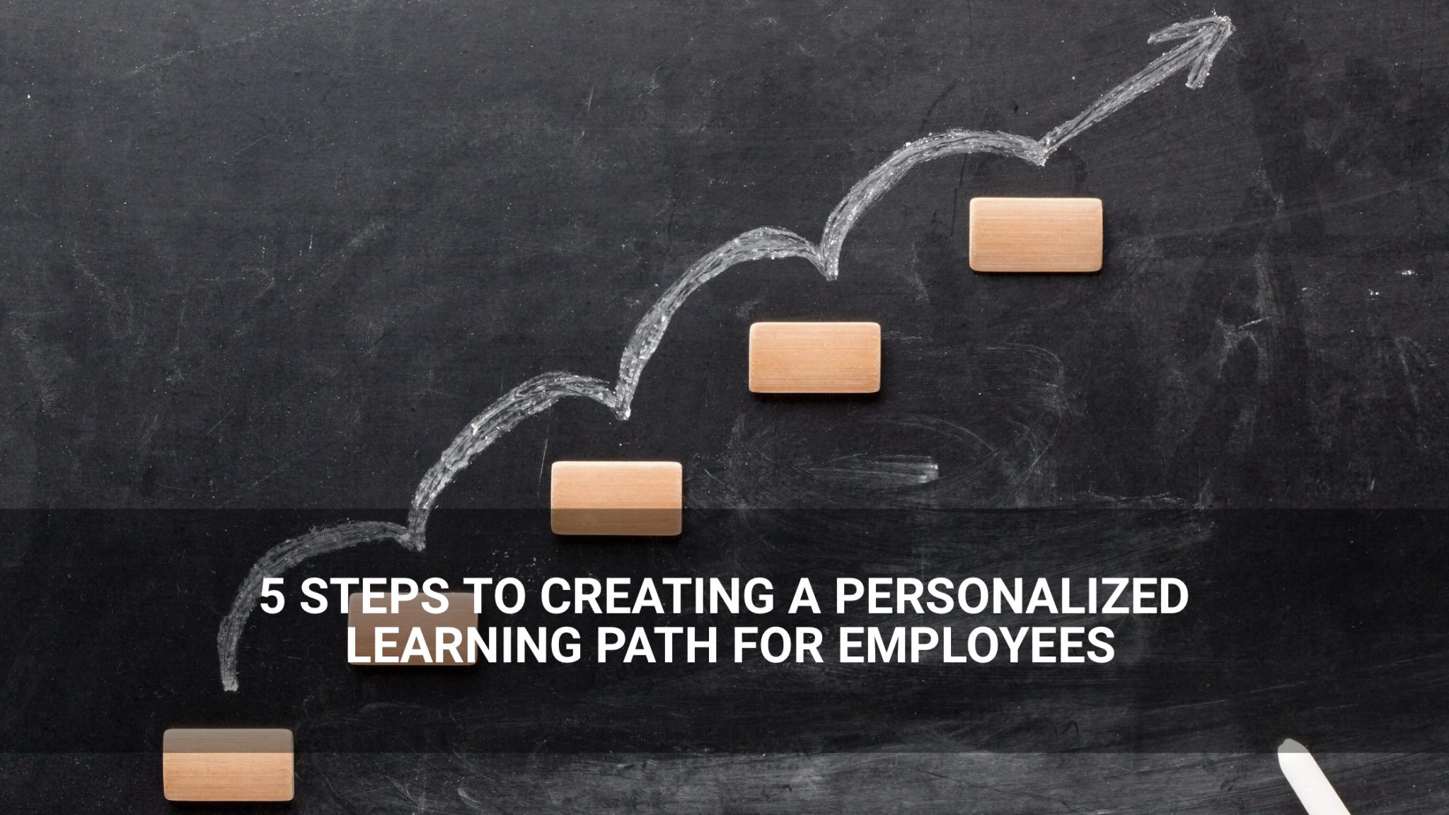 5 Steps to Creating a Personalized Learning Path for Employees- wooden blocks with chalk arrow- Above Promotions
