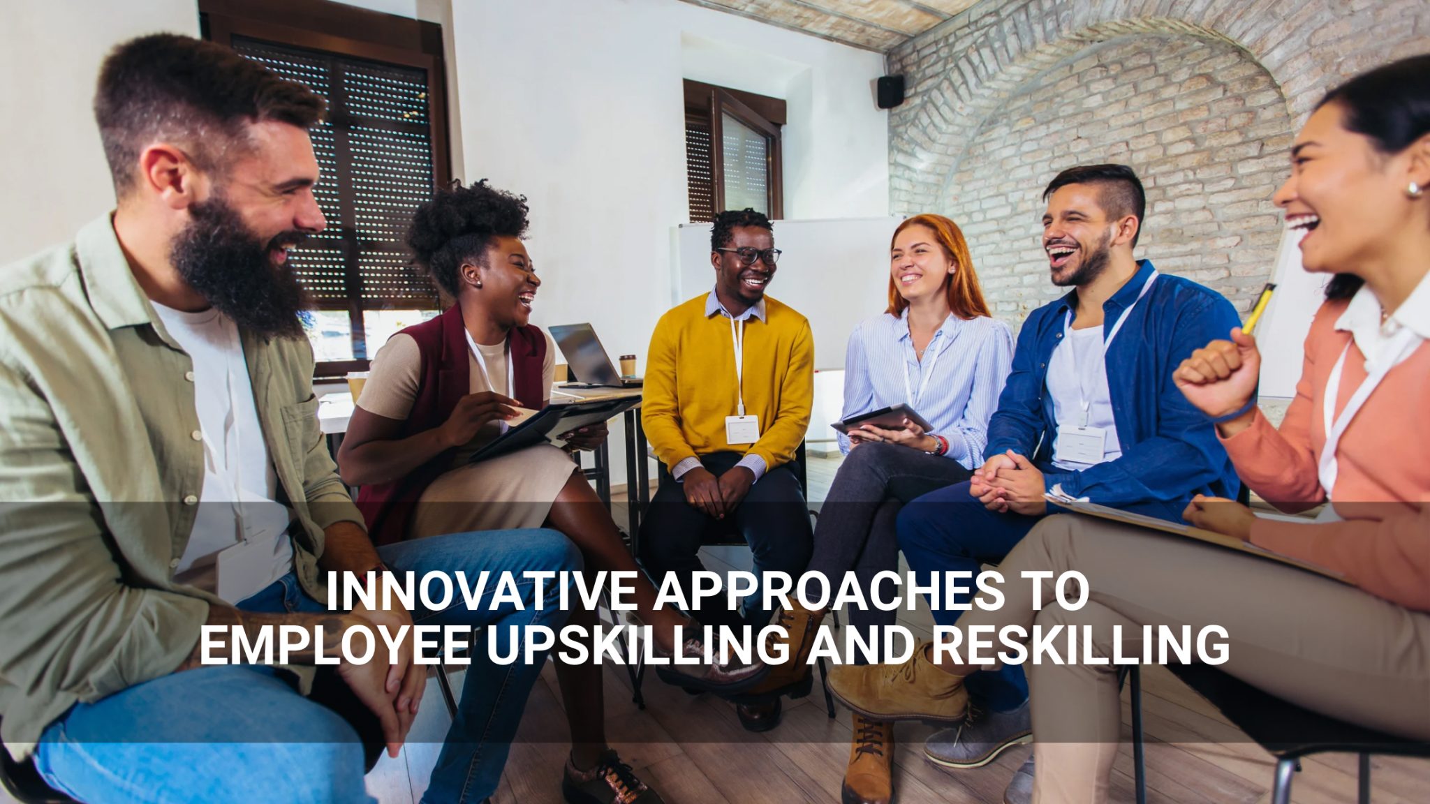 Innovative Approaches to Employee Upskilling and Reskilling - employees gathered in discussion - Above Promotions