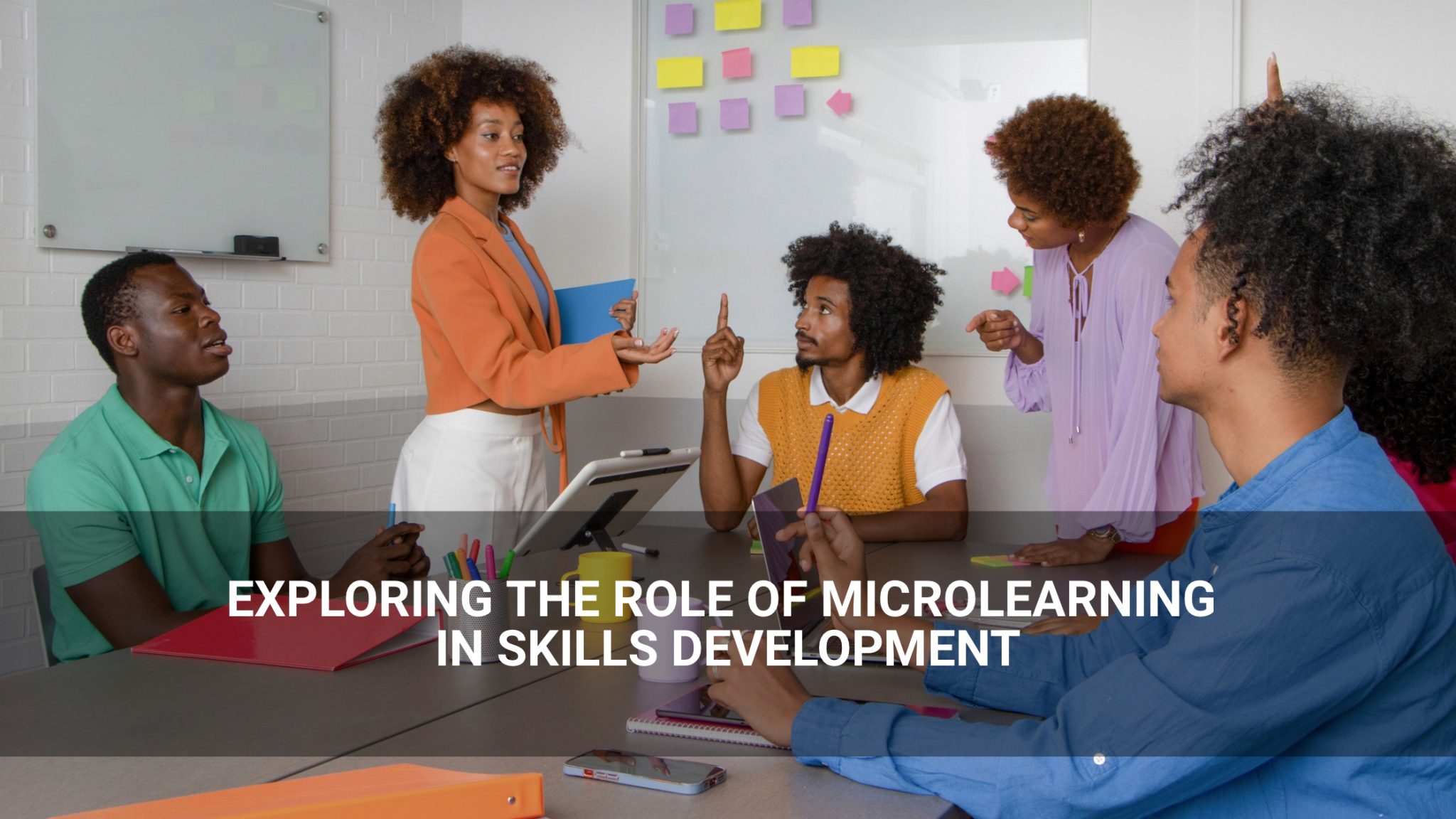 exploring the role of microlearning in skills development. - employees gathered in a meeting - Above Promotions